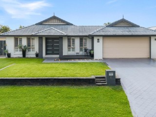 SPACIOUS FAMILY HOME WITH MULTIPLE LIVING ZONES AND RESORT-STYLE POOL 